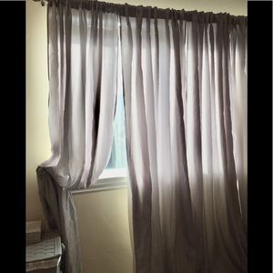 2 panels of light grey curtains